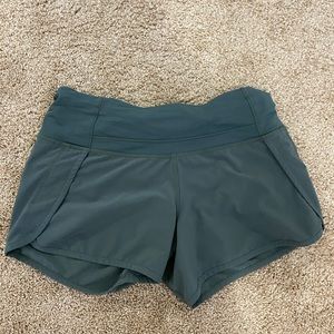 green lululemon shorts